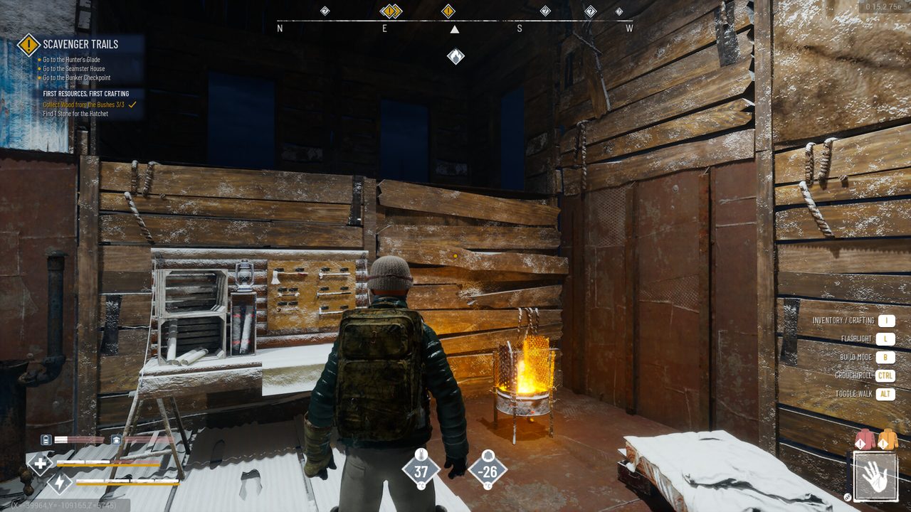 Inside a wooden base with a workbench and a campfire burning